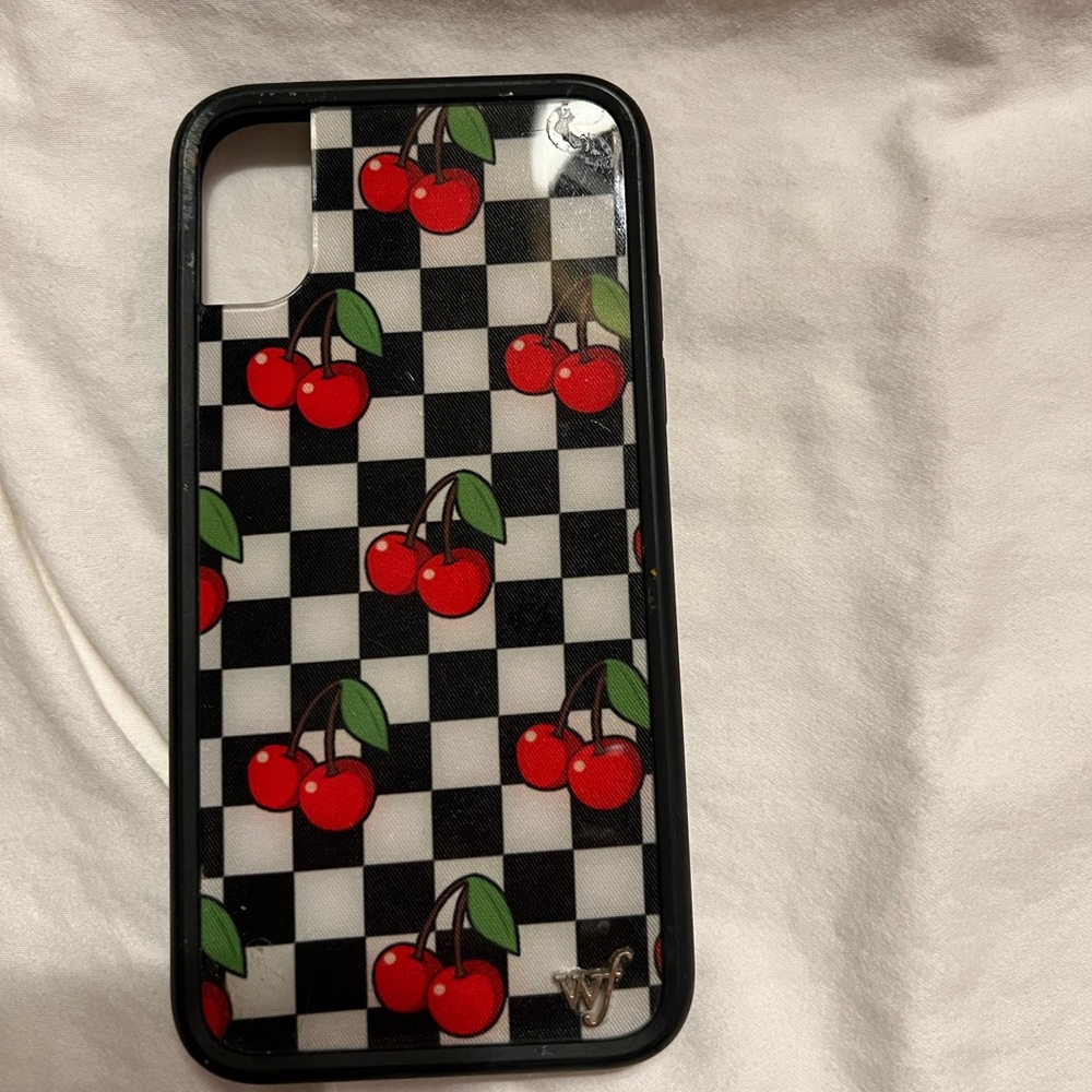 Wildflower case with black and white checkered case with red cherries